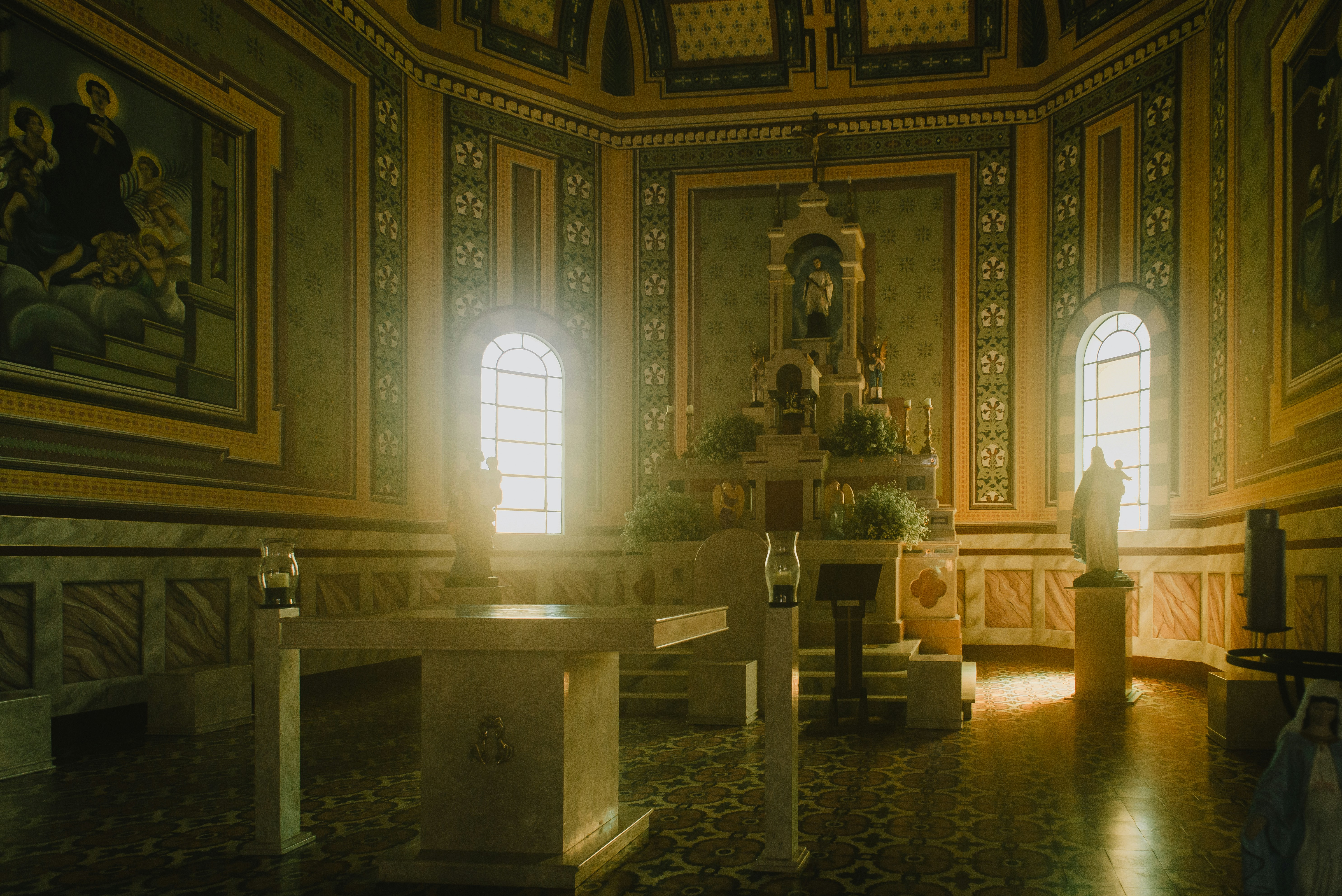 a church with a statue in the middle of the room