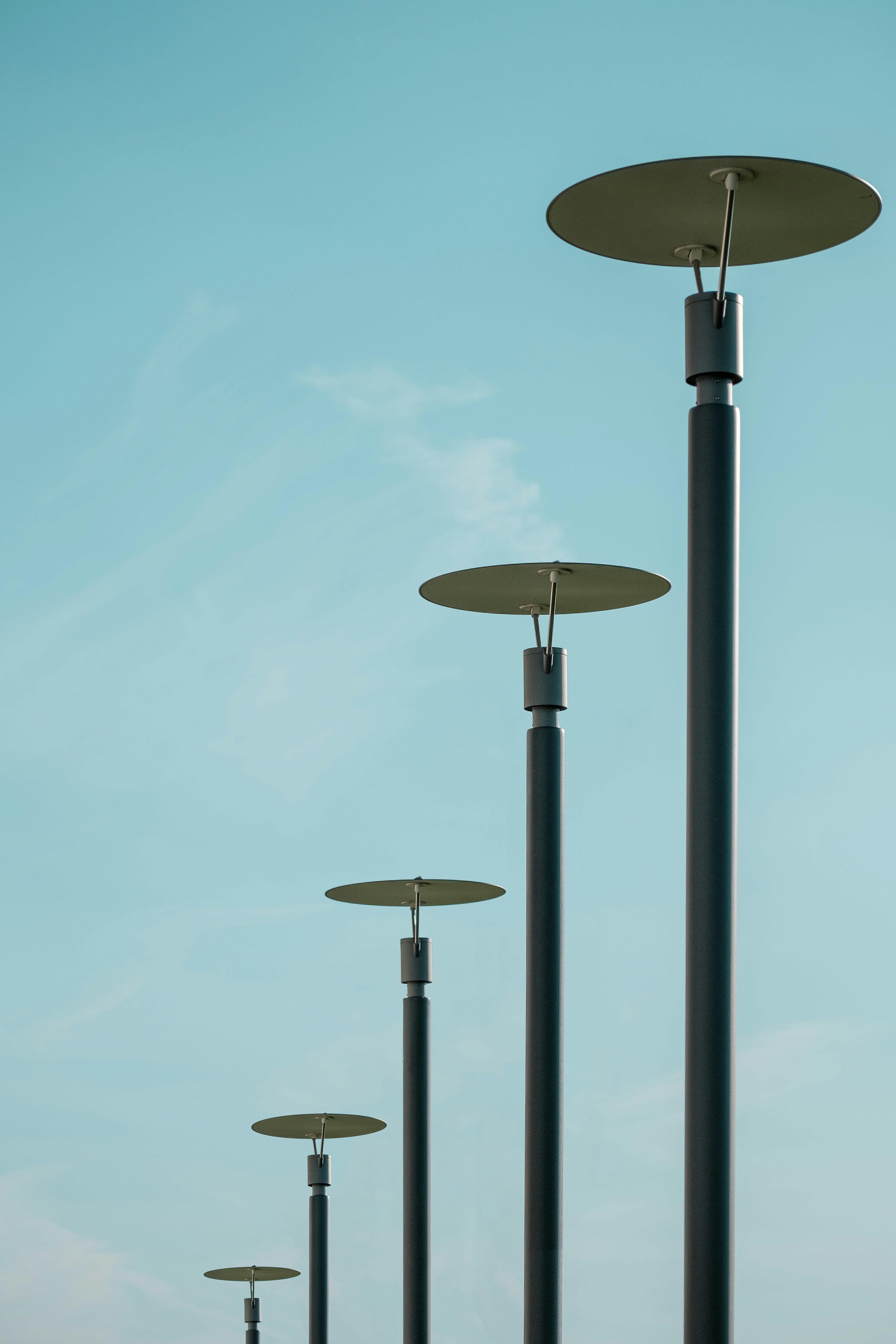 a row of tall metal poles sitting next to each other