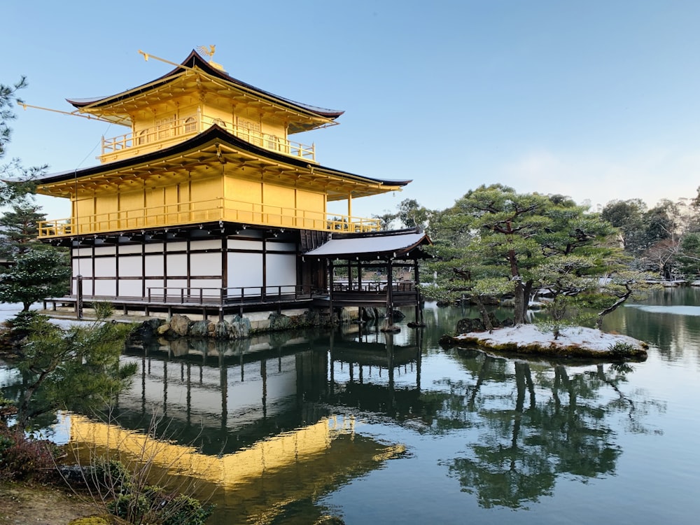 a large yellow building sitting on top of a lake