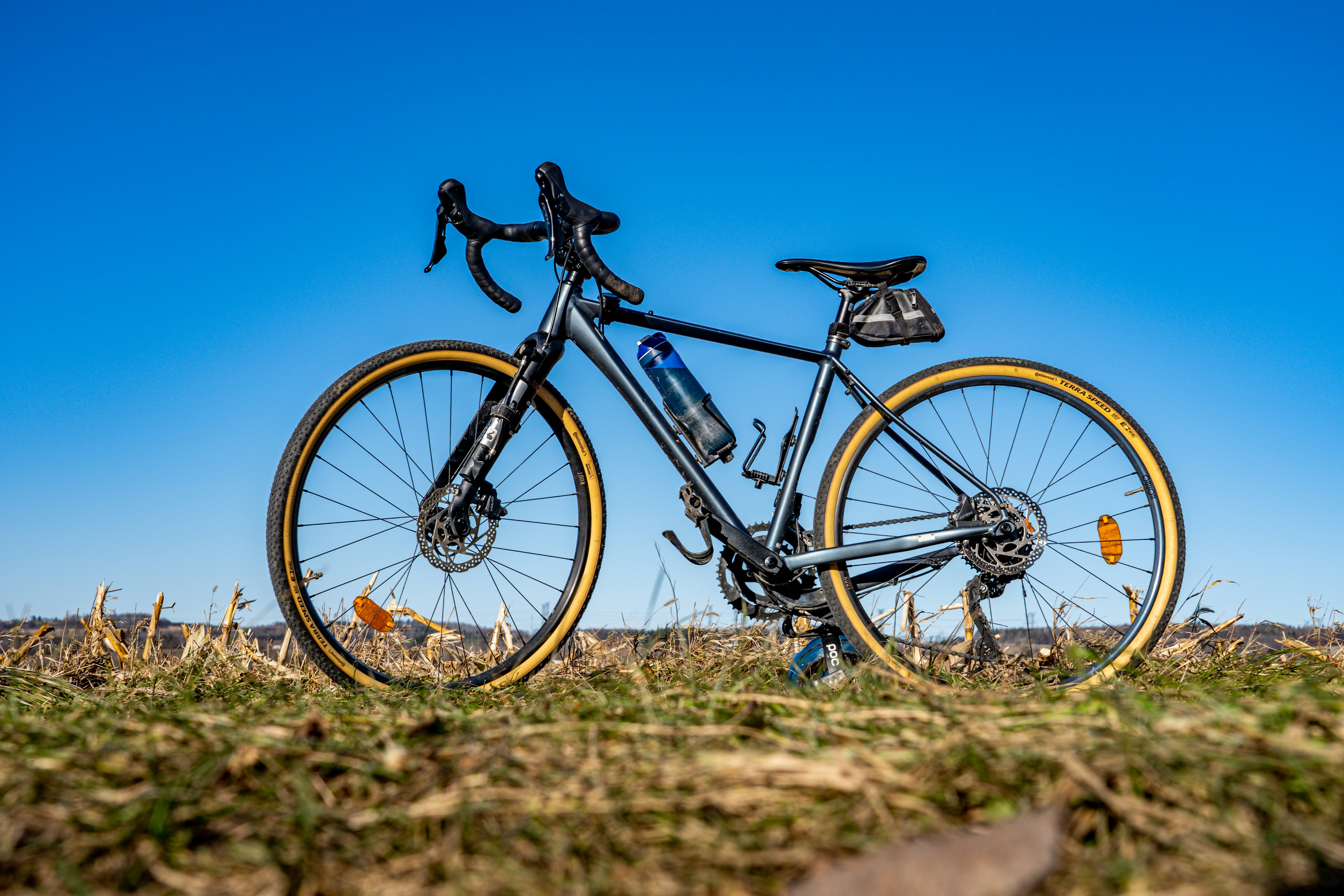 a bike parked in the middle of a field