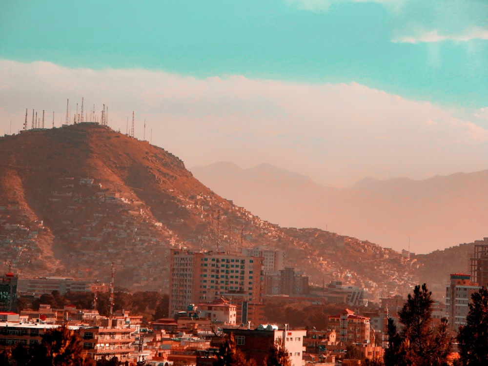 a view of a city with mountains in the background