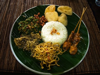 a green plate topped with lots of food