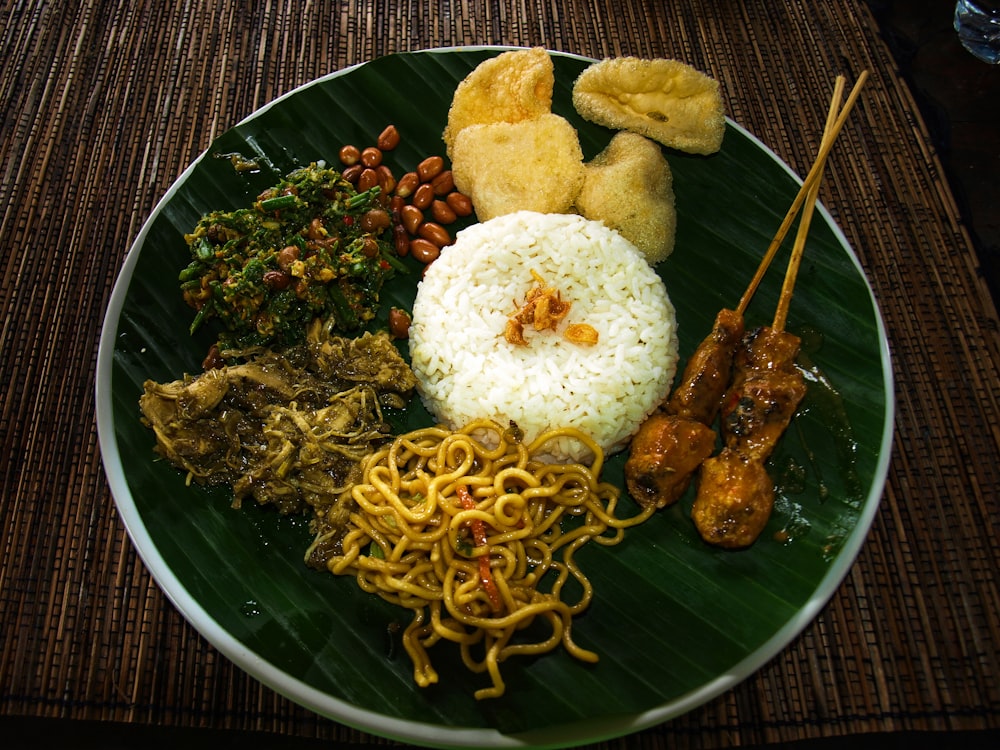 a green plate topped with lots of food
