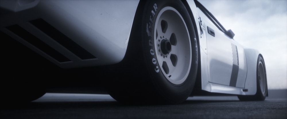 a close up of a car tire on a road