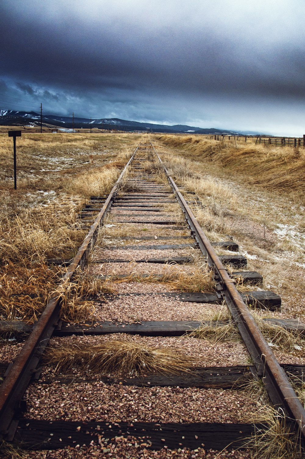 a train track in the middle of a field