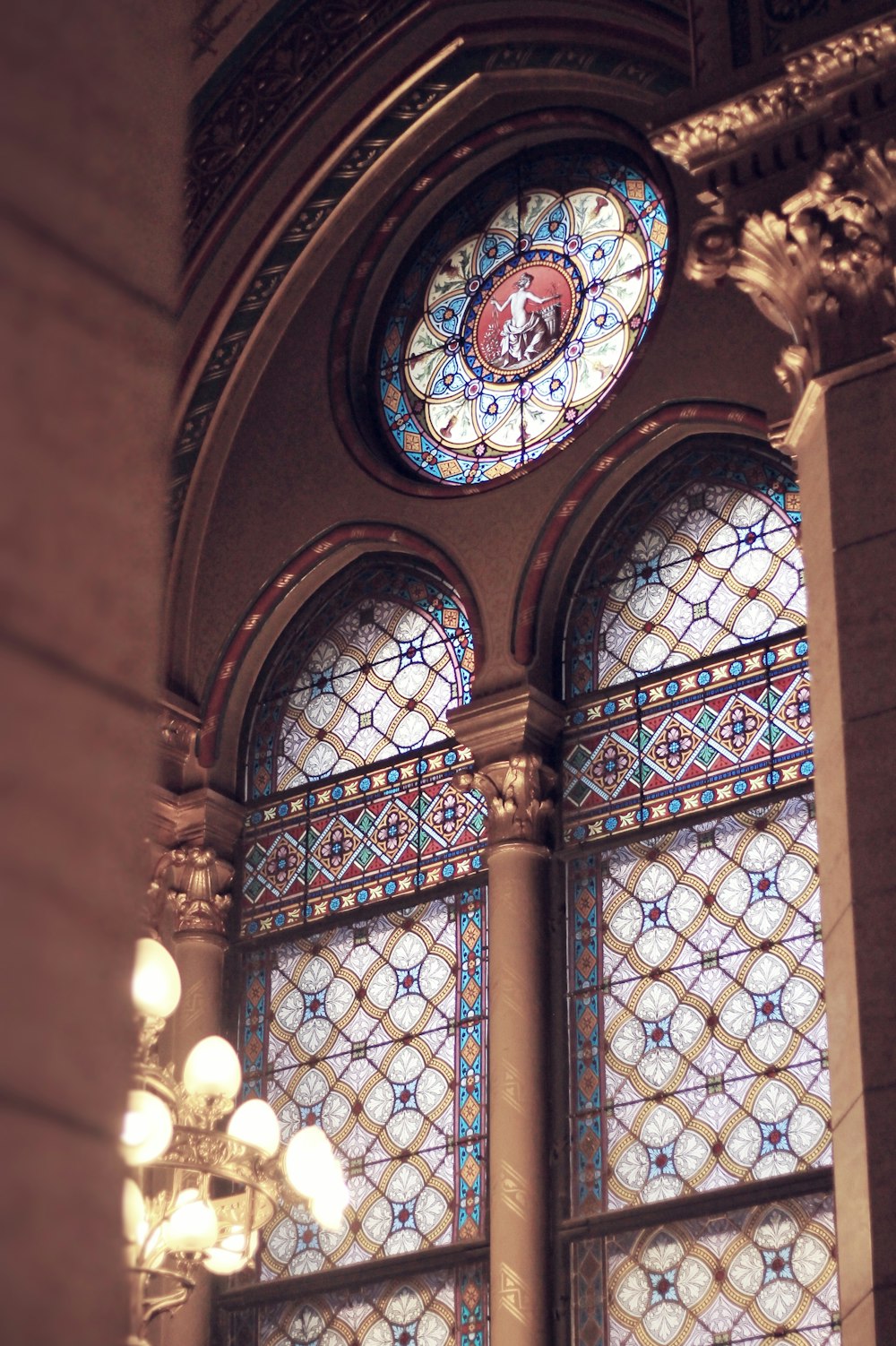 a large stained glass window in a building