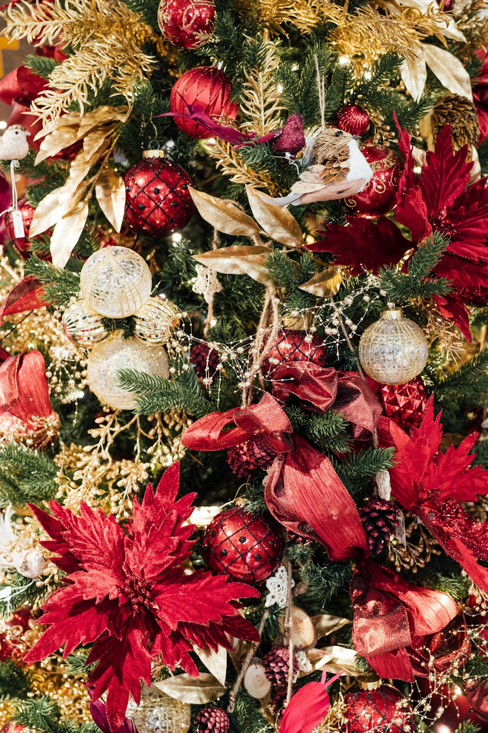 a christmas tree with red and gold decorations