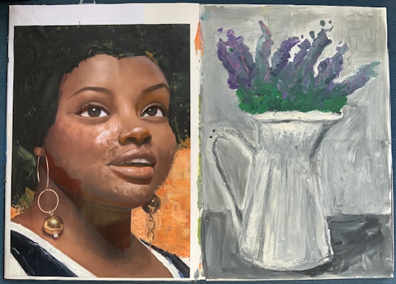 A two-page artwork features a realistic portrait of a person with expressive eyes and textured skin. The figure wears statement earrings. On the opposite page, a monochromatic painting shows a white pitcher holding a bouquet of purple flowers with green foliage.