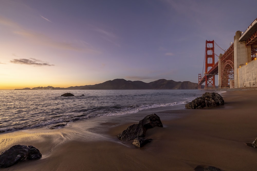 a view of the golden gate bridge from the beach