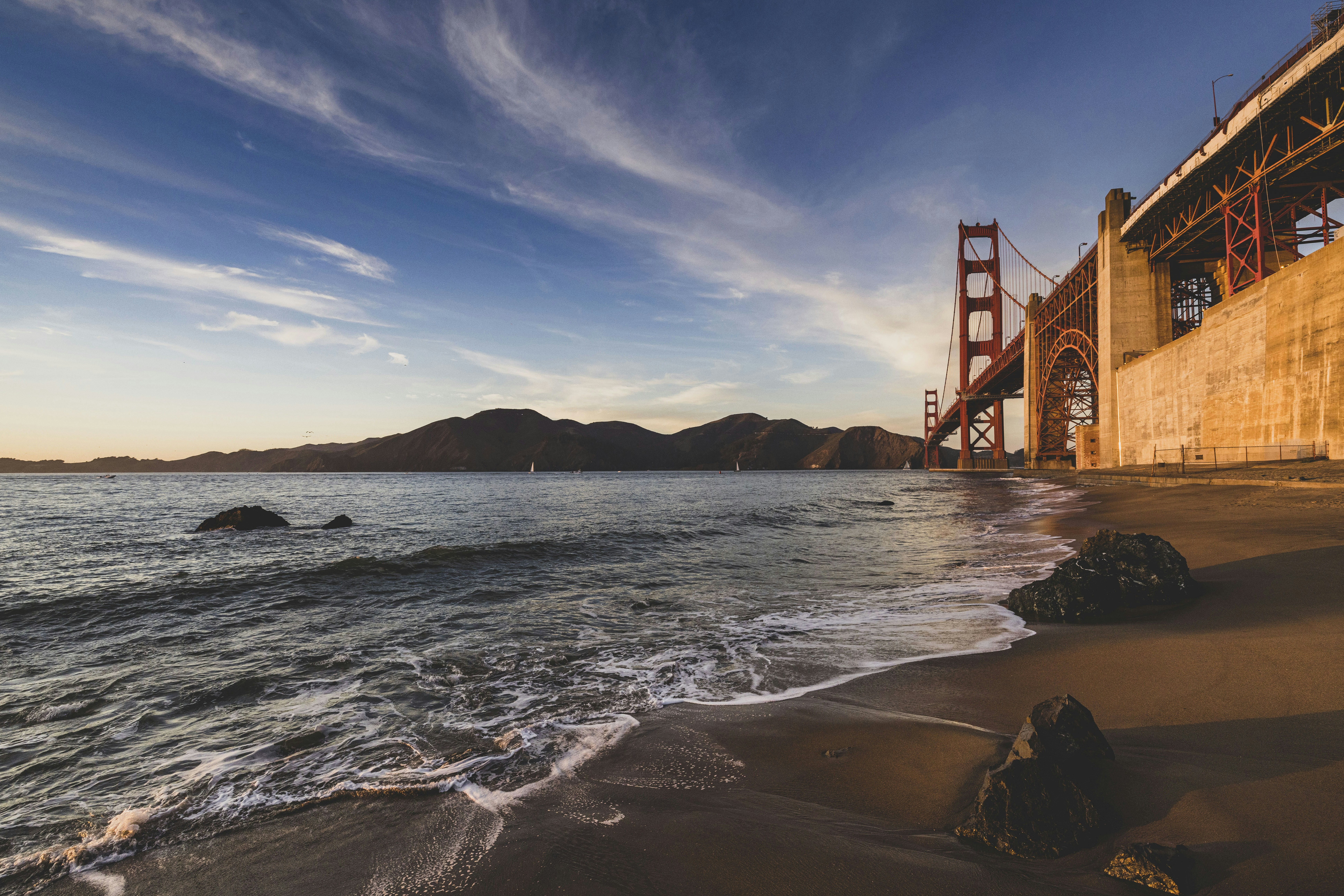 8 Affordable Destinations Where Your Dollar Stretches Further in 2024 – a view of the golden gate bridge from the beach