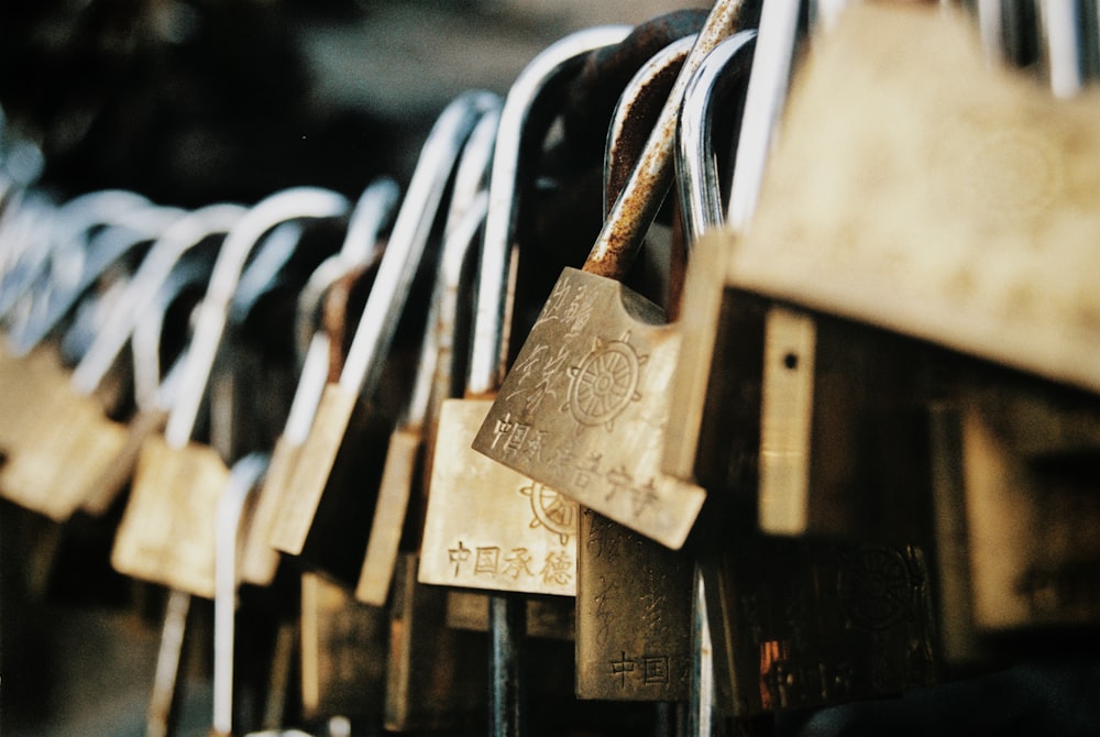 a bunch of padlocks hanging on a wall