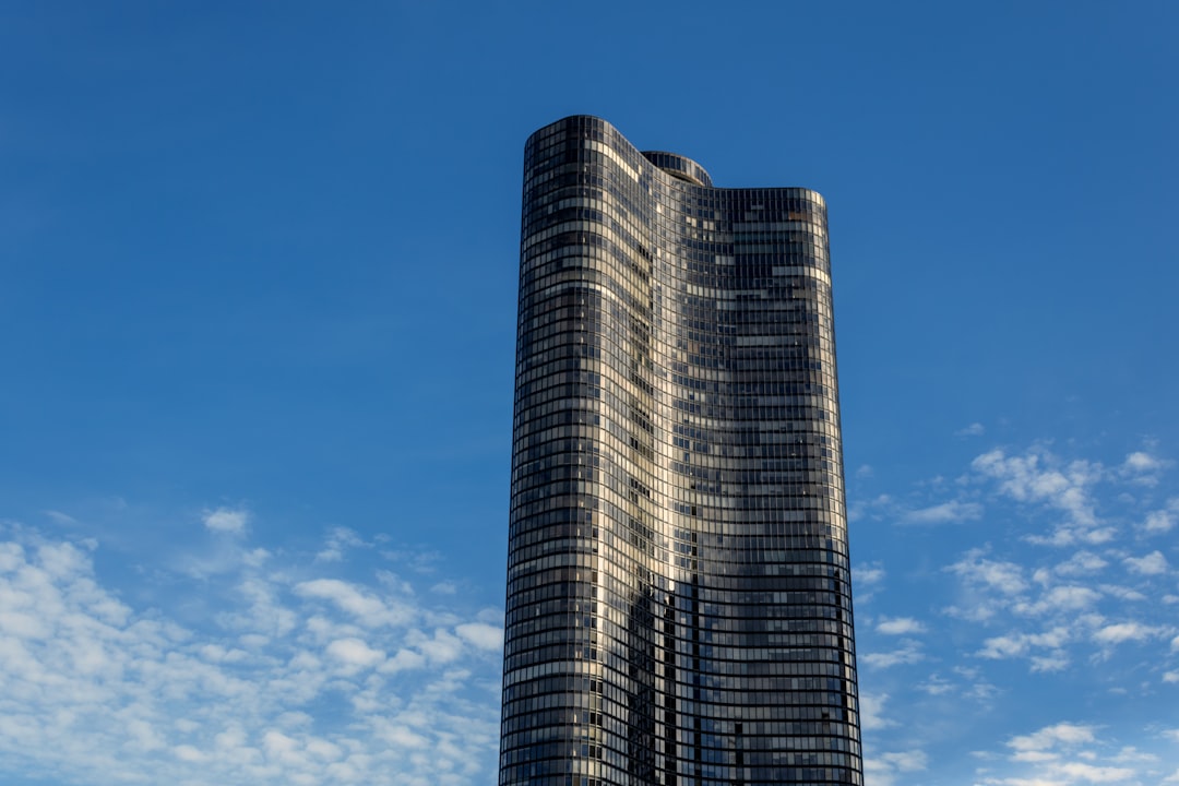 a very tall building sitting under a blue sky, Looks so symmetrical
