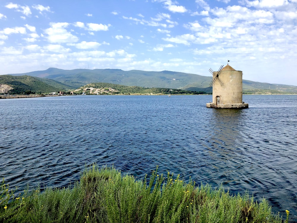 a large body of water with a tower in the middle of it