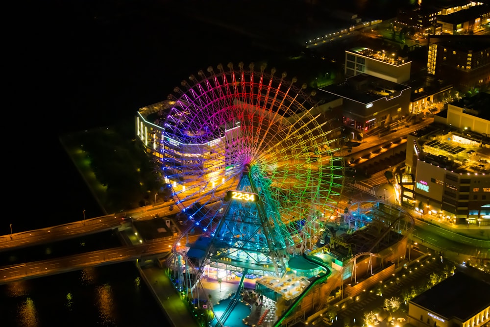 an aerial view of a ferris wheel at night