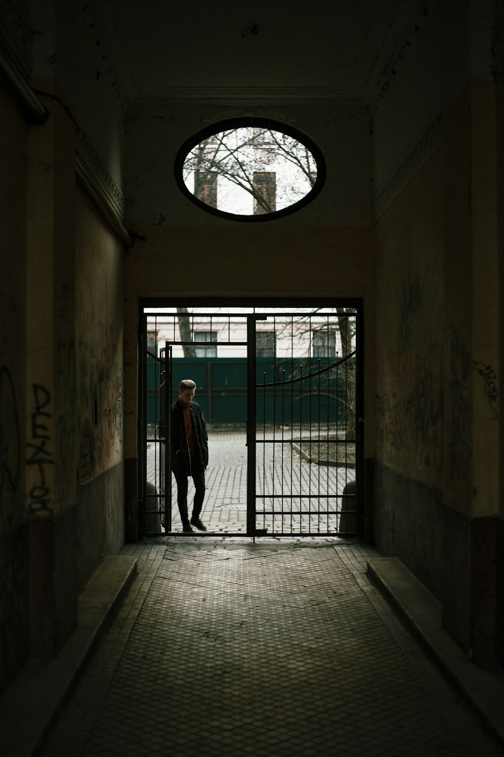 a man standing in a doorway of a building