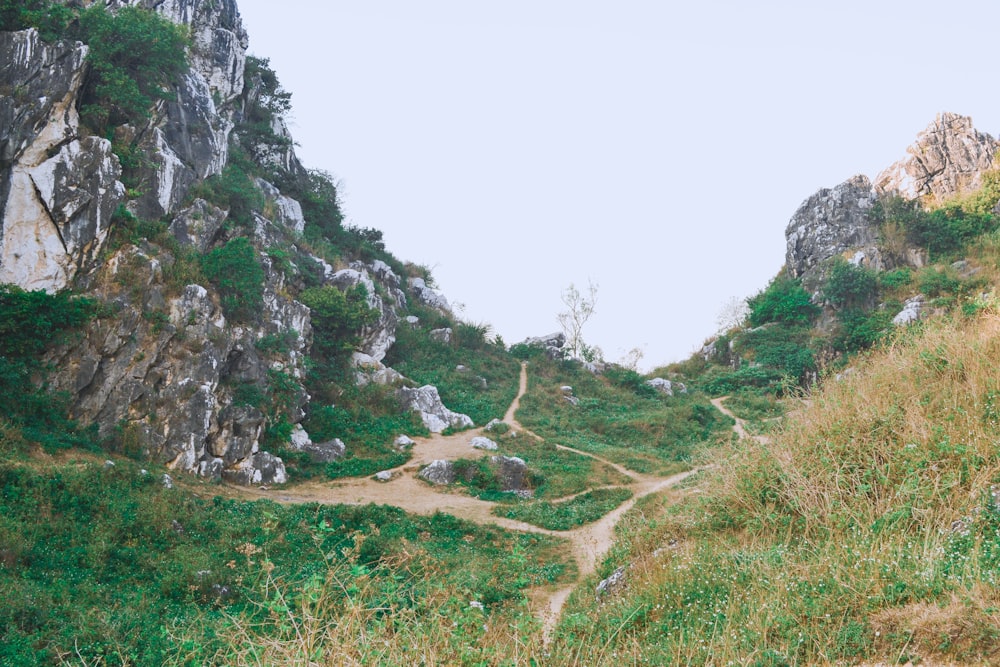 a dirt path in the middle of a mountain