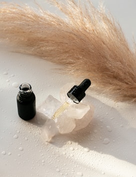 a bottle of cologne next to a bottle of cologne