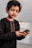 a young boy holding a smart phone in his hands