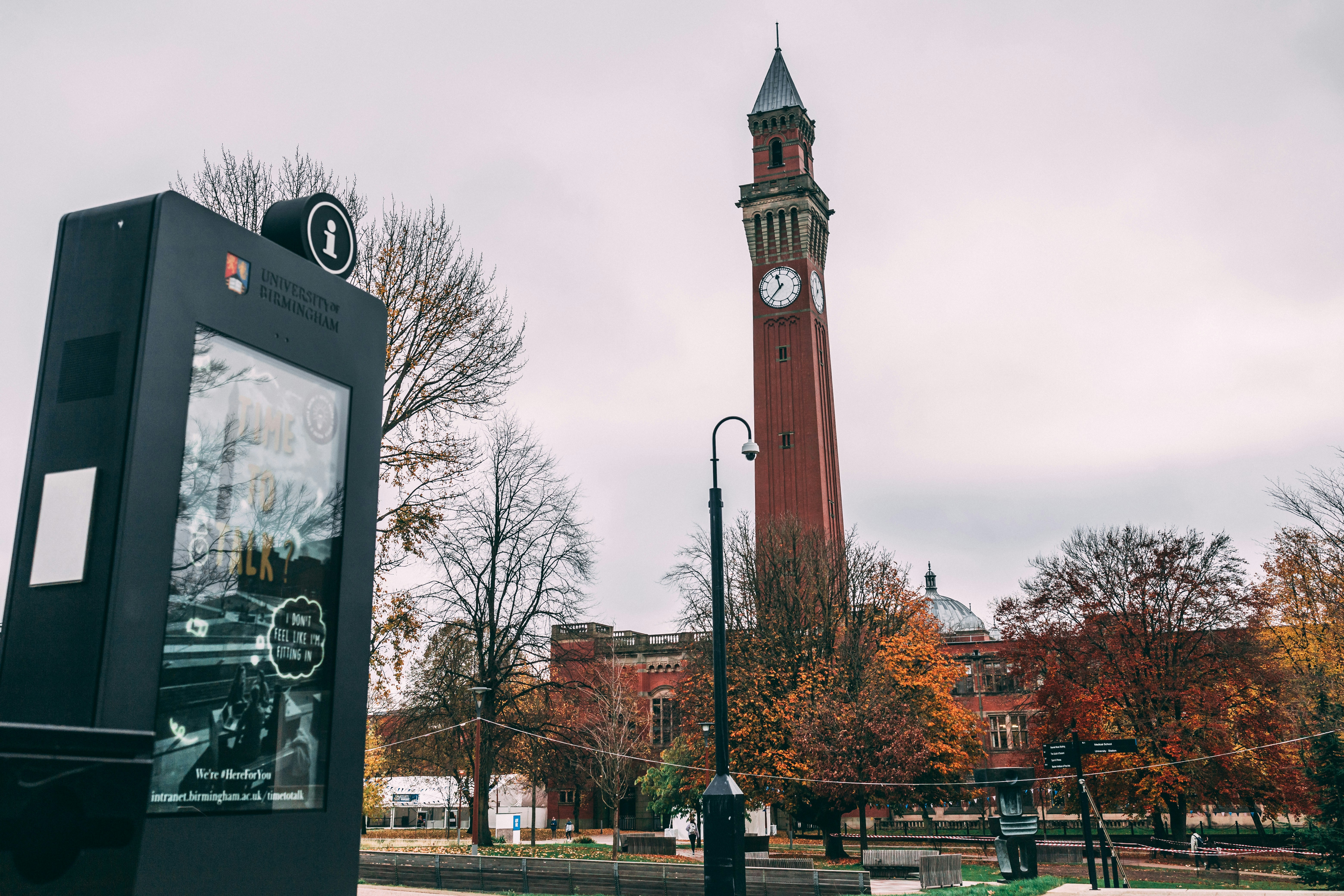 a tall clock tower towering over a city