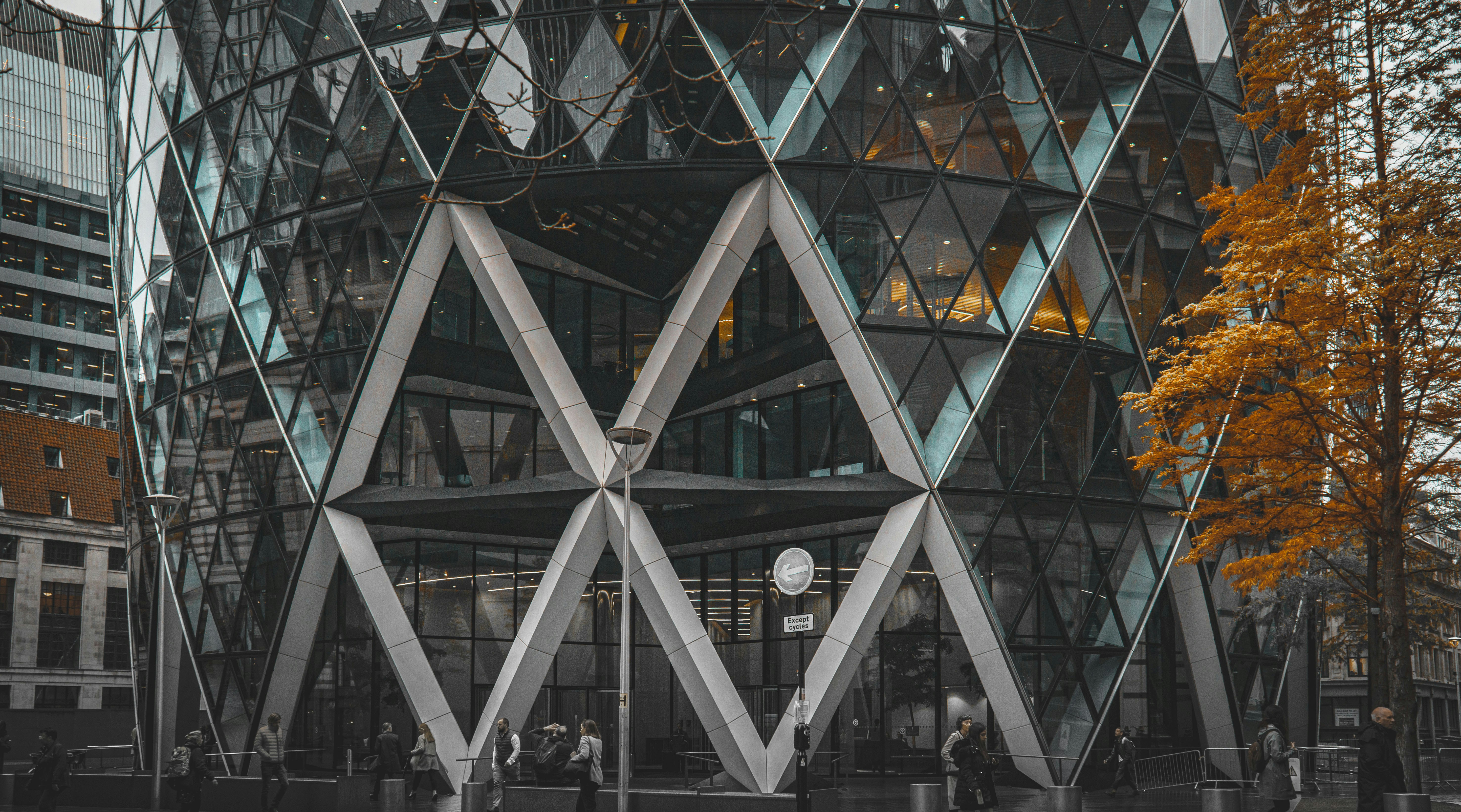 A modern building with a lattice work of panes of glass.