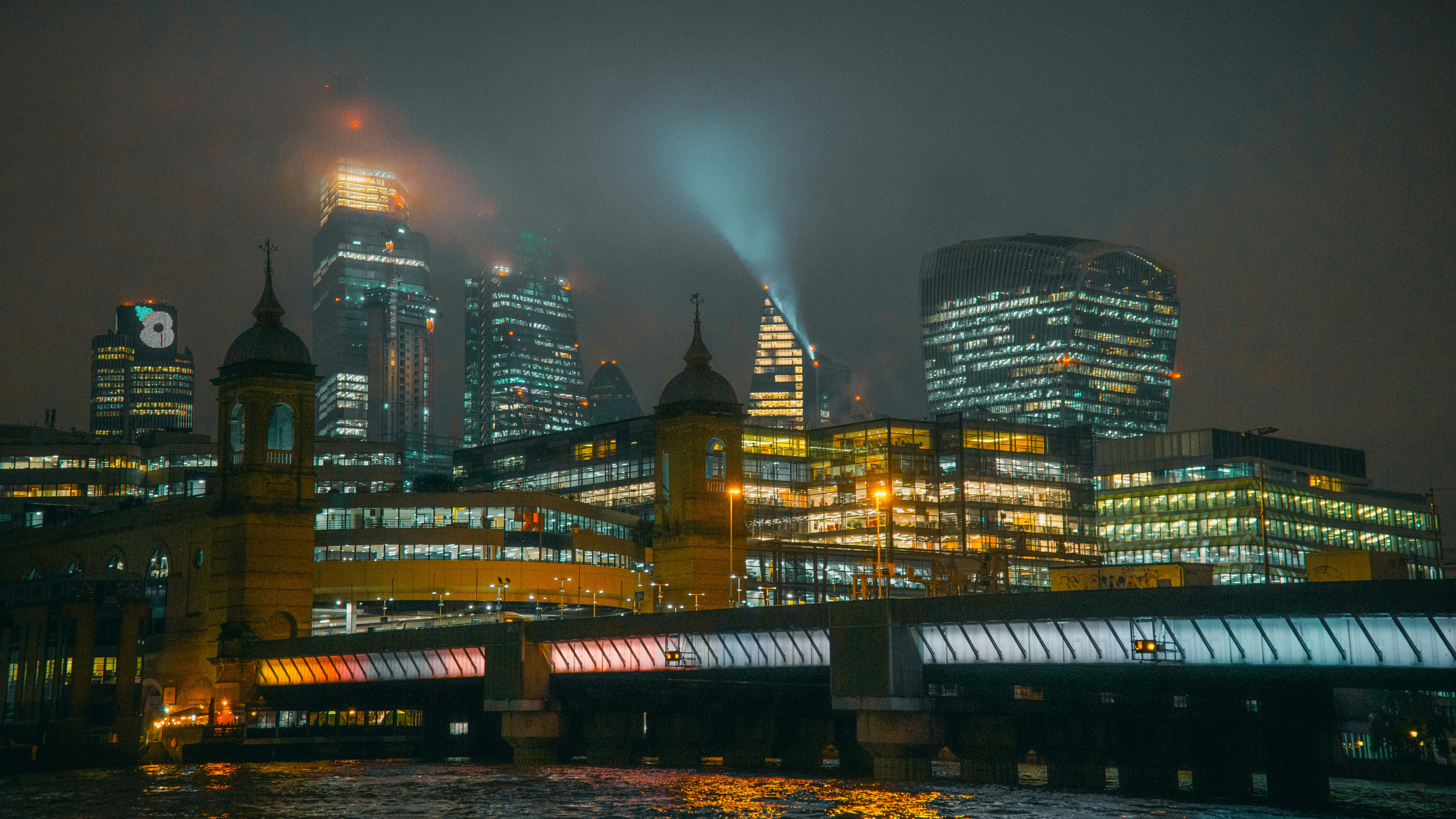 a view of a city at night from across the river