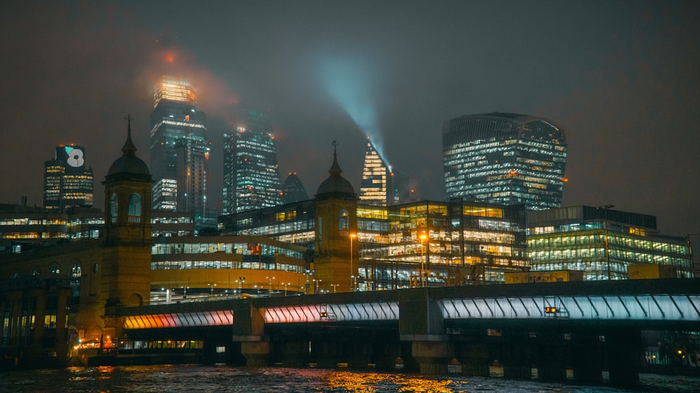 a view of a city at night from across the river