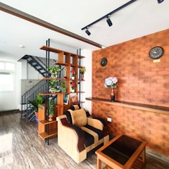 a living room filled with furniture and a staircase
