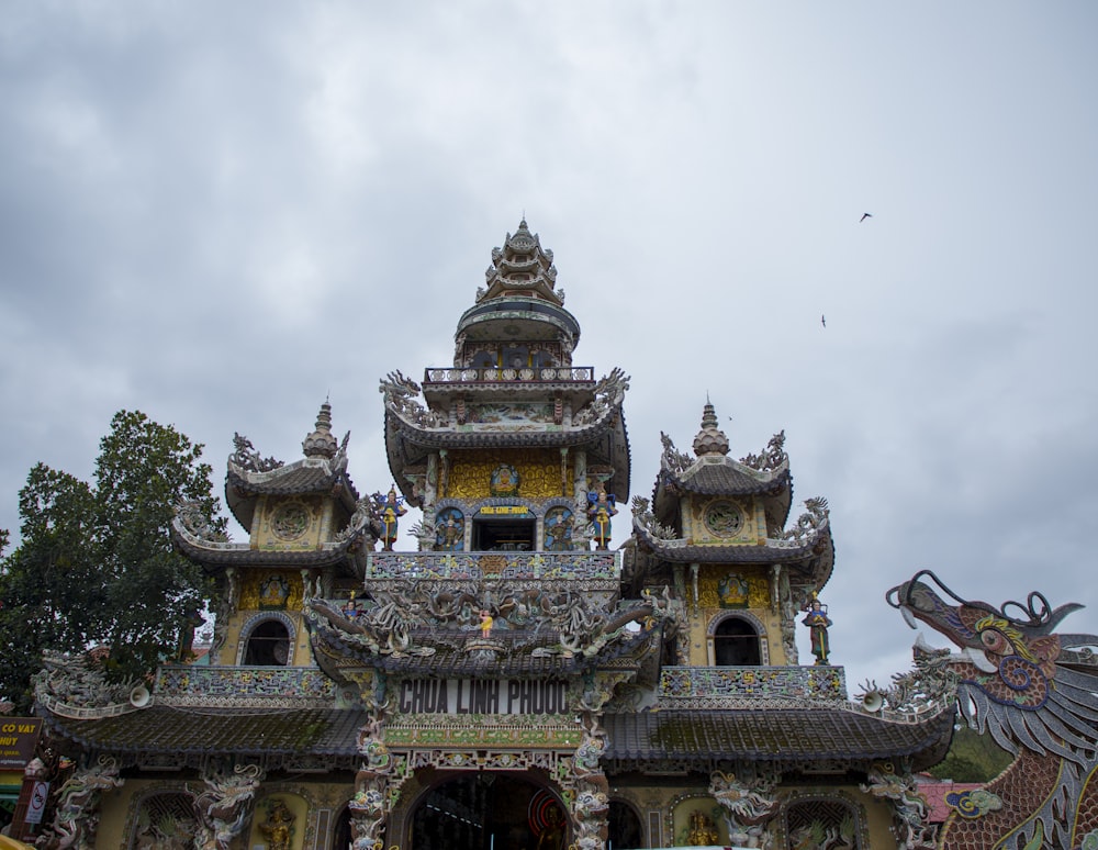 a building with a dragon statue in front of it