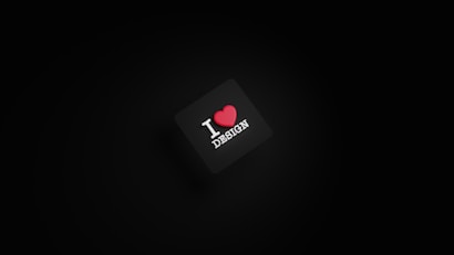 A dark background with a black square in the center. The square has the text 'I ❤️ DESIGN' with the heart symbol in red color.