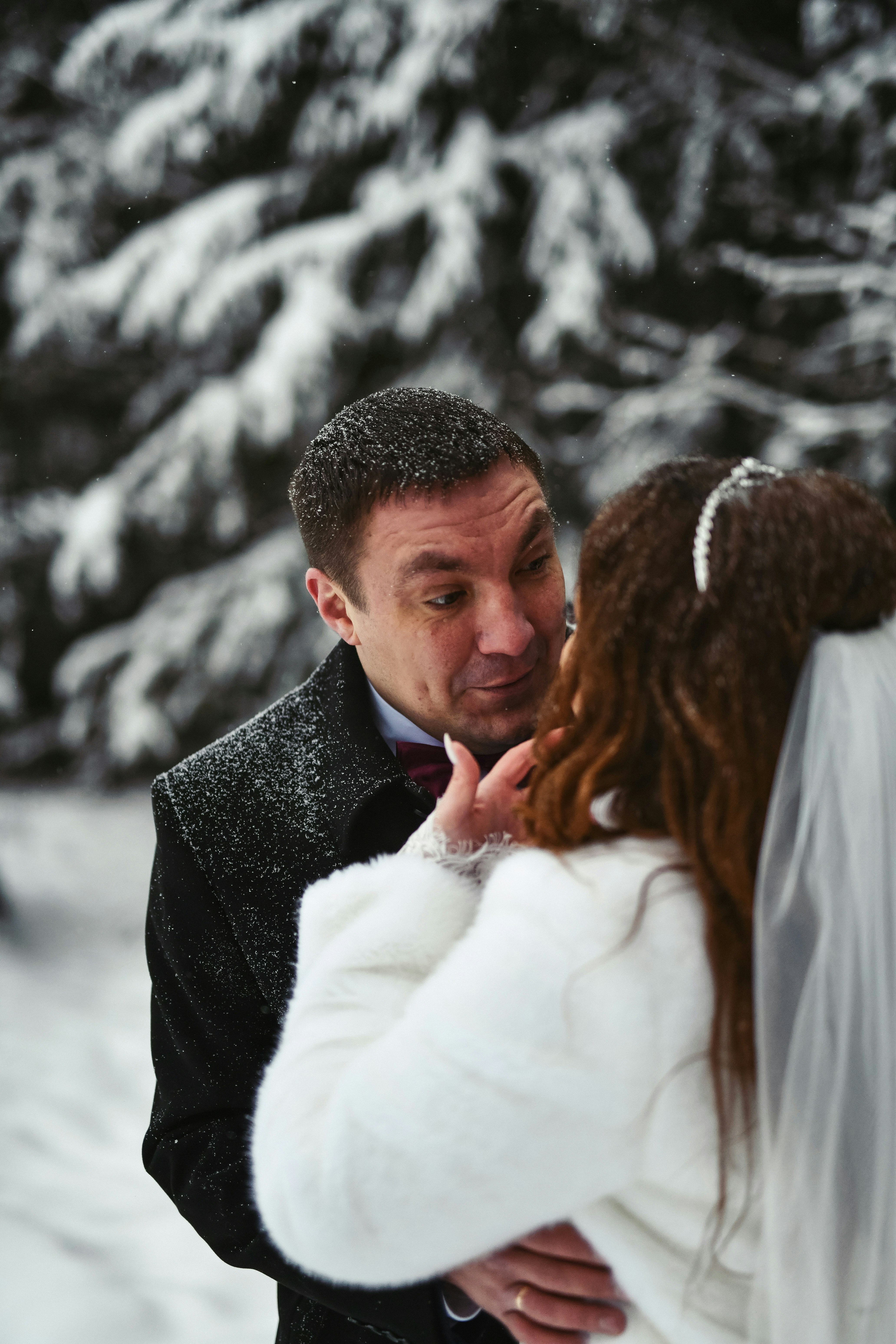 a man that is standing in the snow