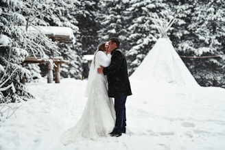 a man that is standing in the snow