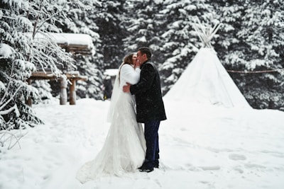 a man that is standing in the snow