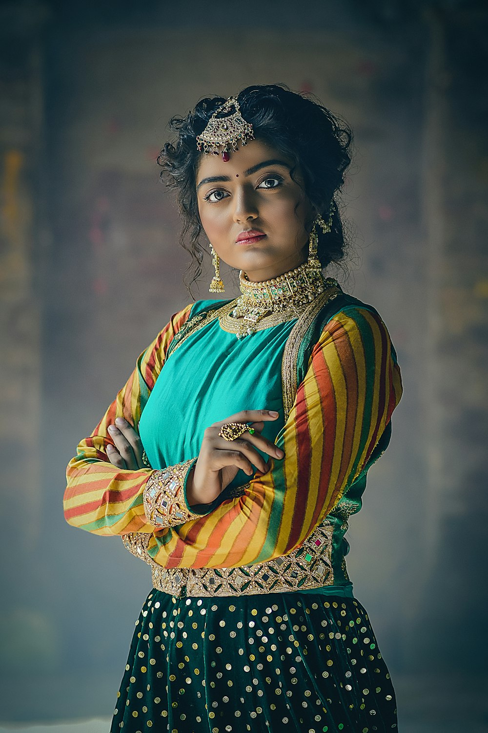a woman in a colorful outfit posing for a picture
