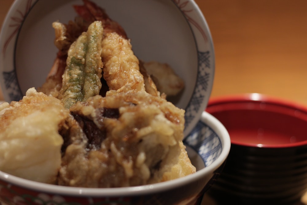 a close up of a bowl of food on a table