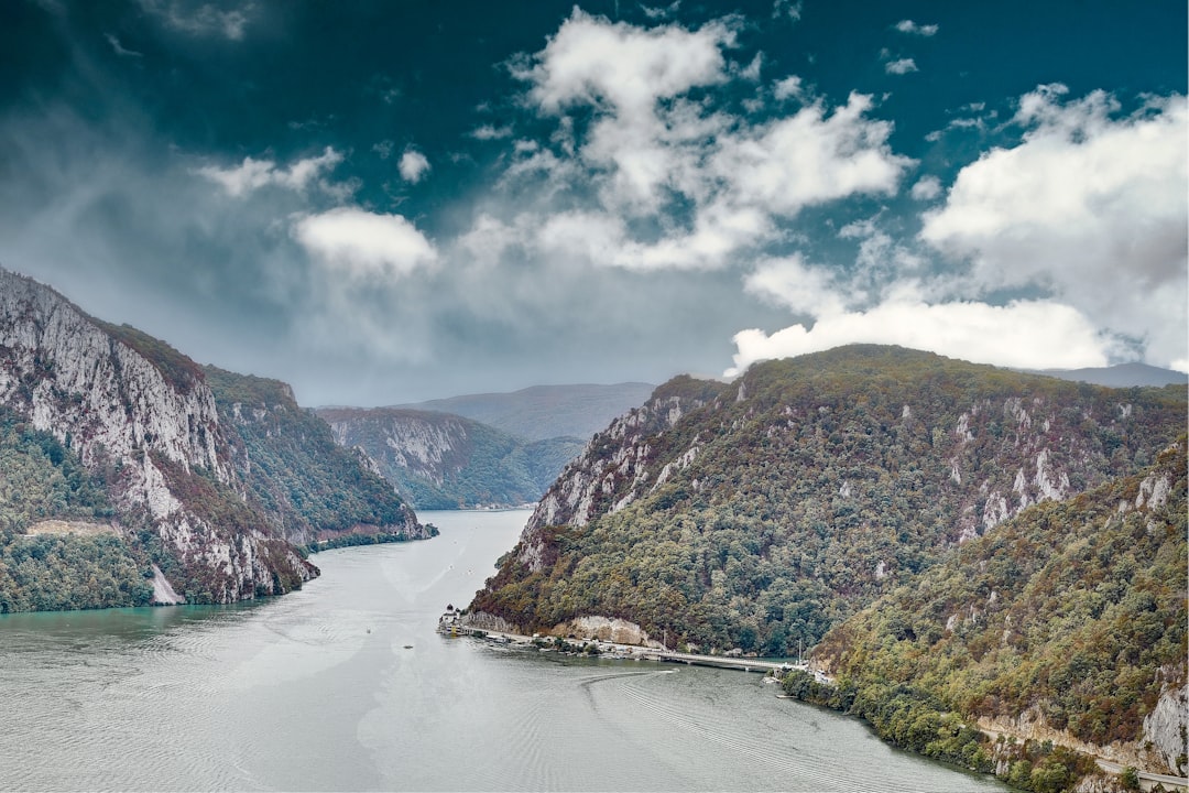 a large body of water surrounded by mountains, Border Serbia-Romania