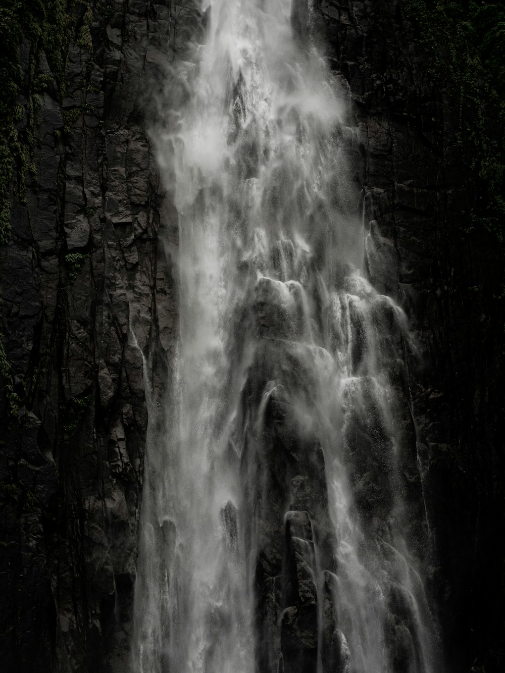 a large waterfall with lots of water coming out of it