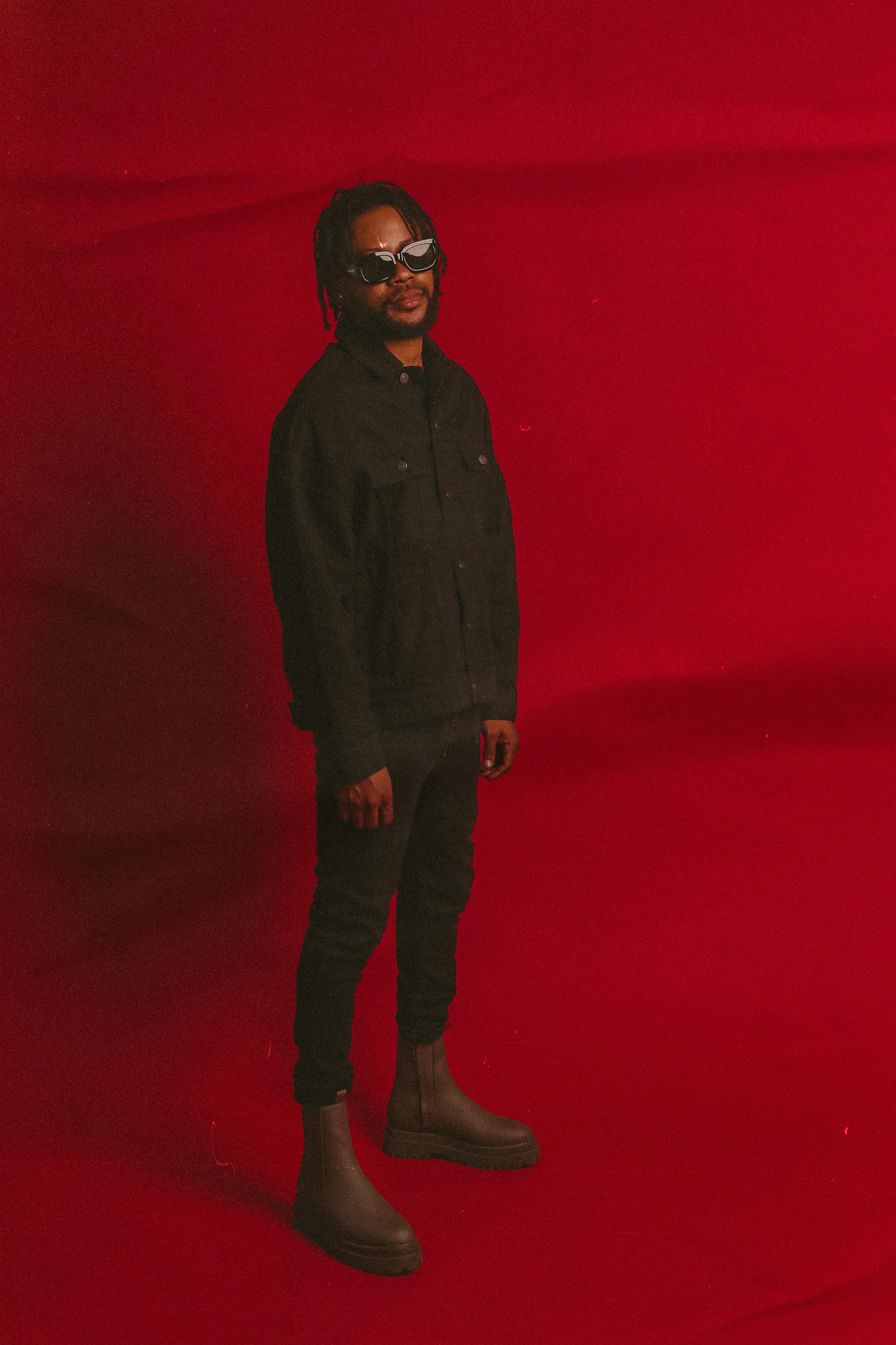 A man standing in front of a red background photo – Free Apparel Image ...