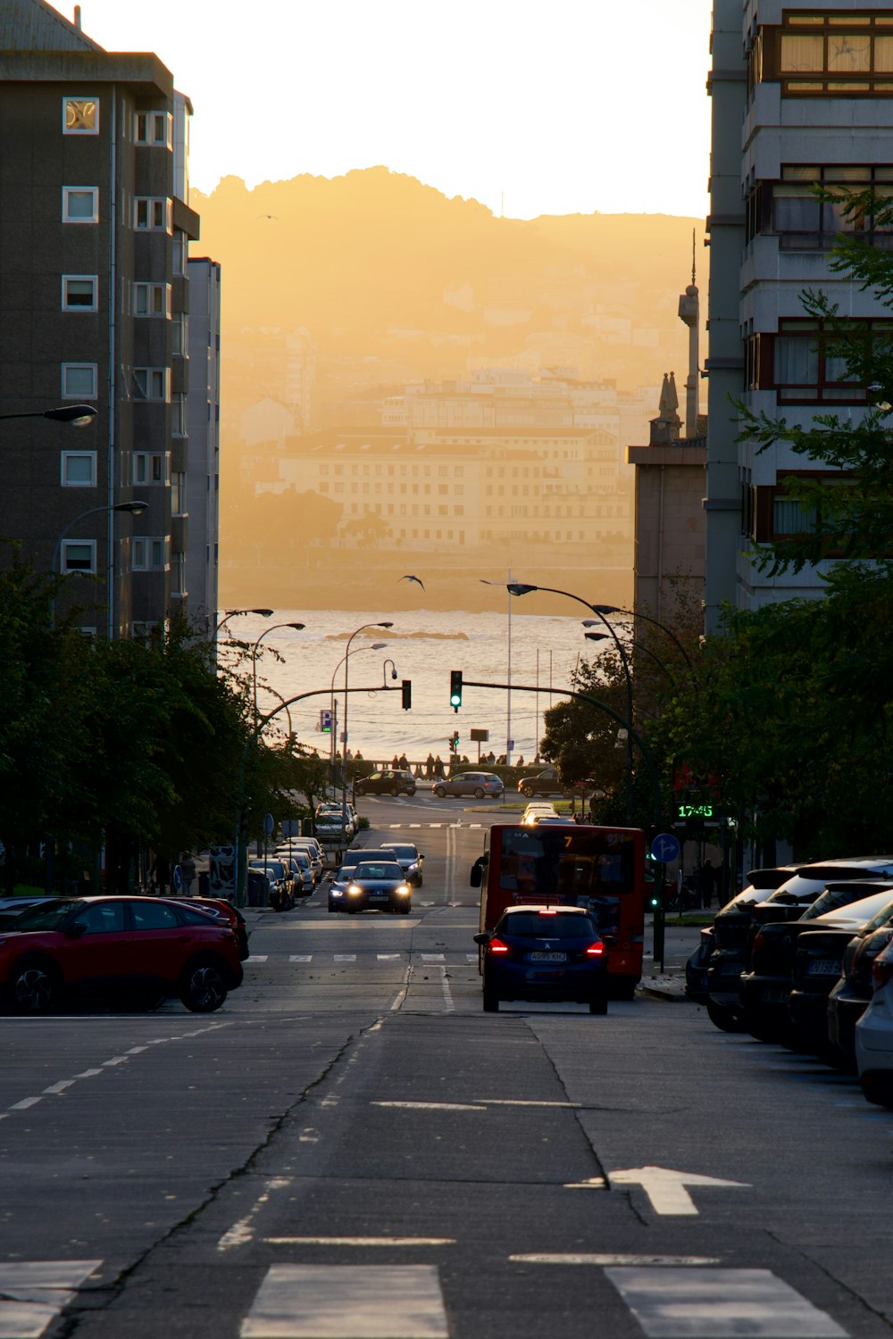 a city street with cars parked on the side of it