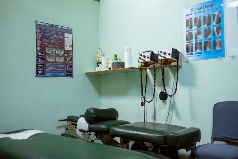 a room with a chair, shelf, and a poster on the wall