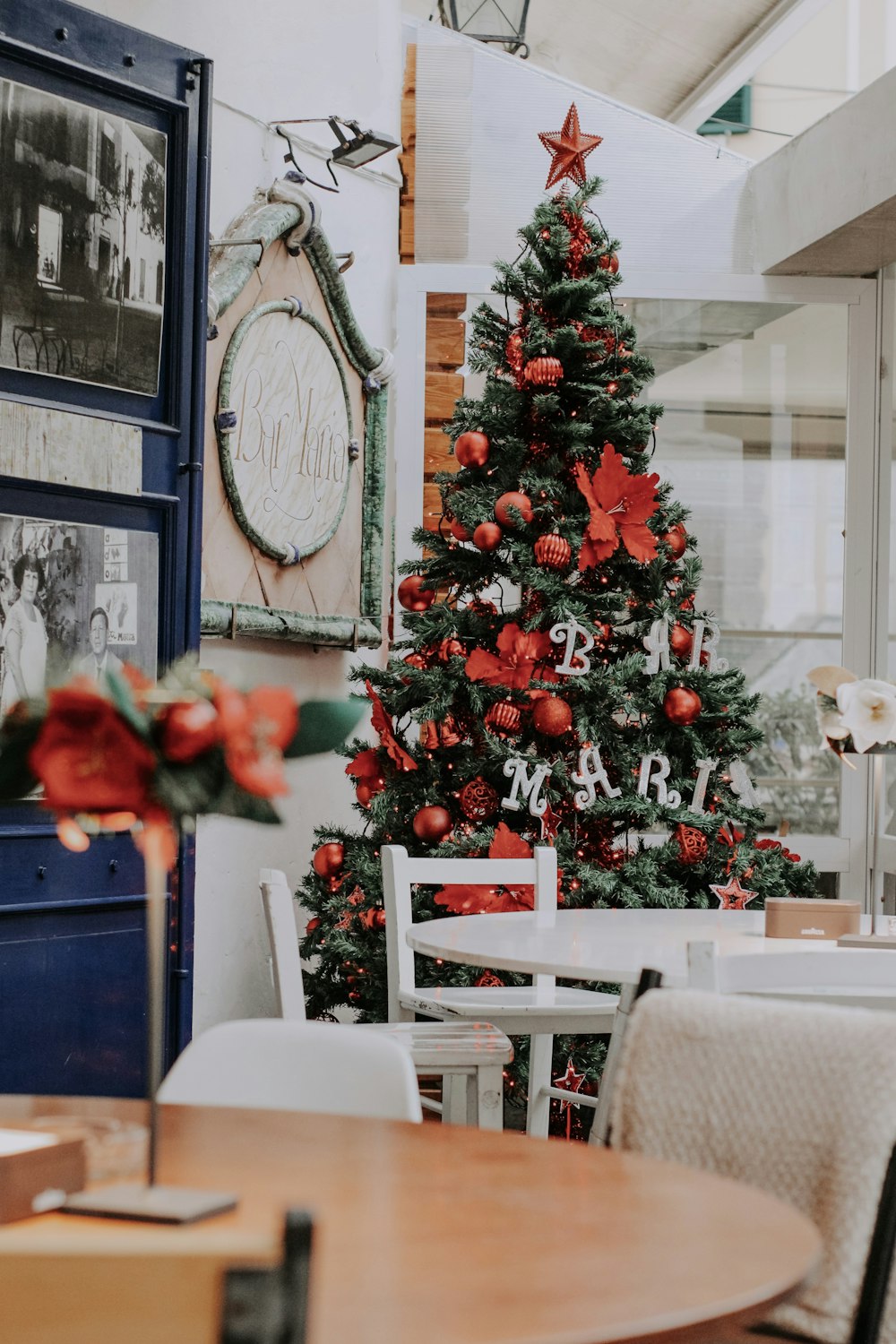 a decorated christmas tree in a restaurant