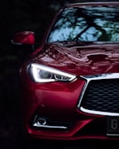 a close up of the front of a red car