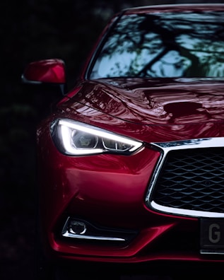 a close up of the front of a red car