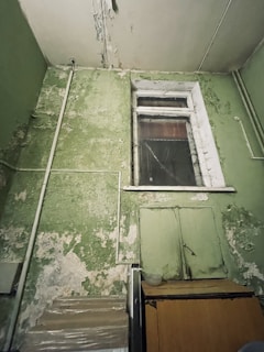 Before and after photos of a room affected by condensation, showing the restored dry walls.