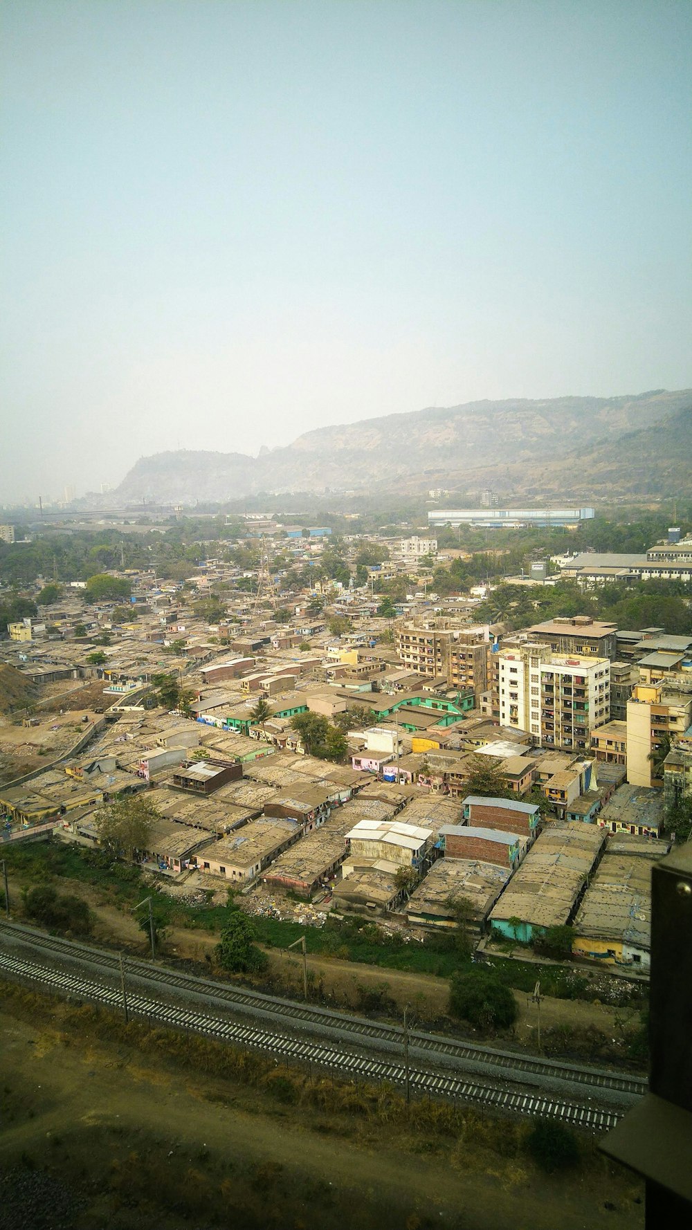 a view of a city from a train window