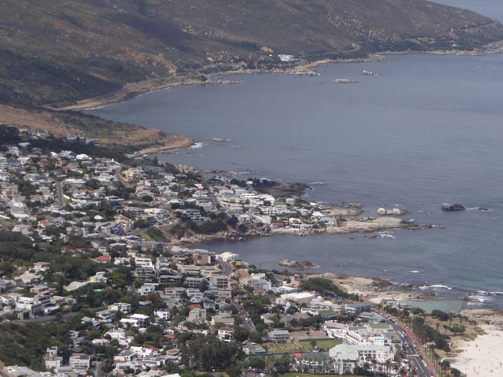 an aerial view of a city by the ocean