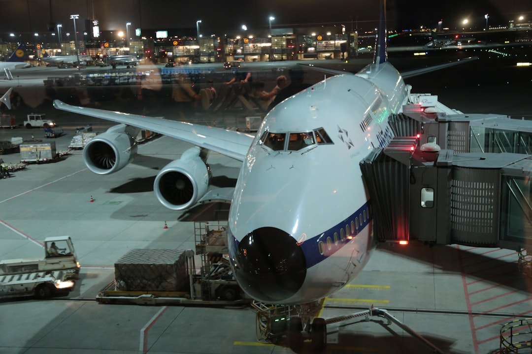 a large jetliner sitting on top of an airport tarmac, Lufthansa Boeing 747-800 in classic design at Frankfurt Airport