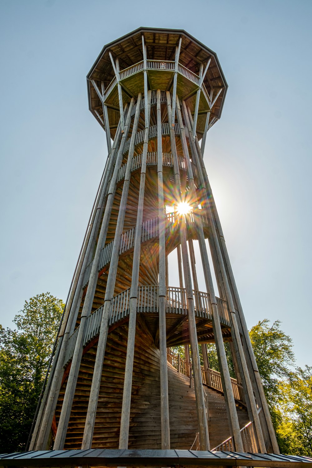 a tall wooden tower with a spiral staircase