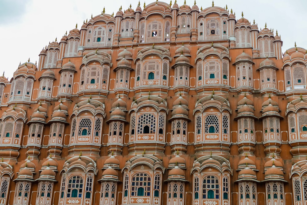 a very tall building with many windows and balconies