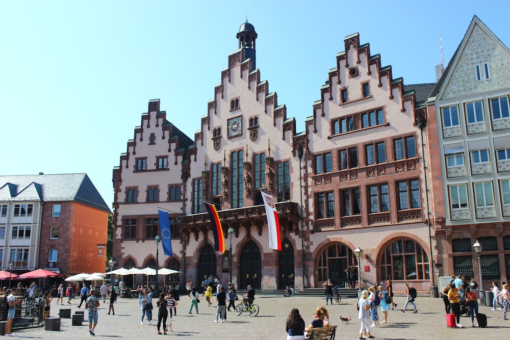 a group of people standing in front of a building