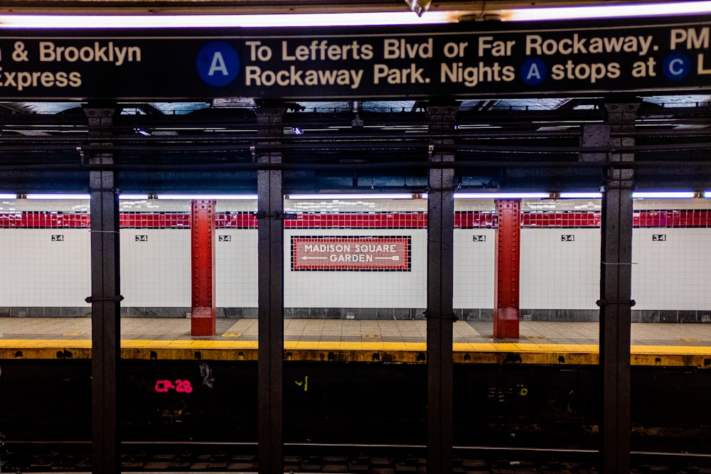 a subway station with a sign that says rockaway park nights stops at l a